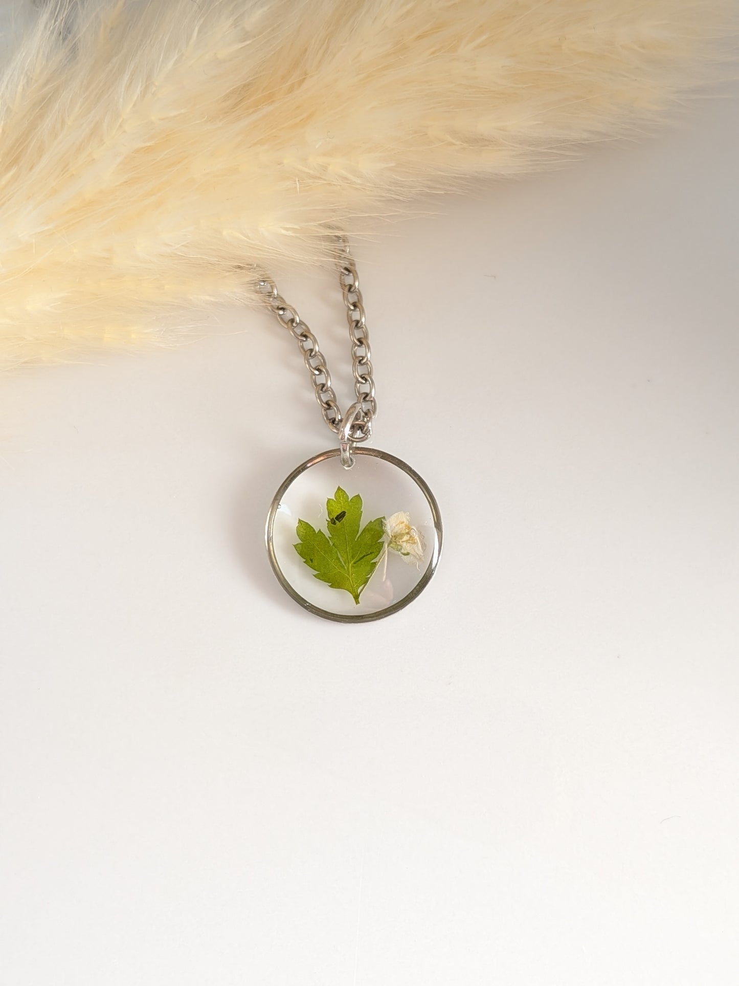 White flower with greenery