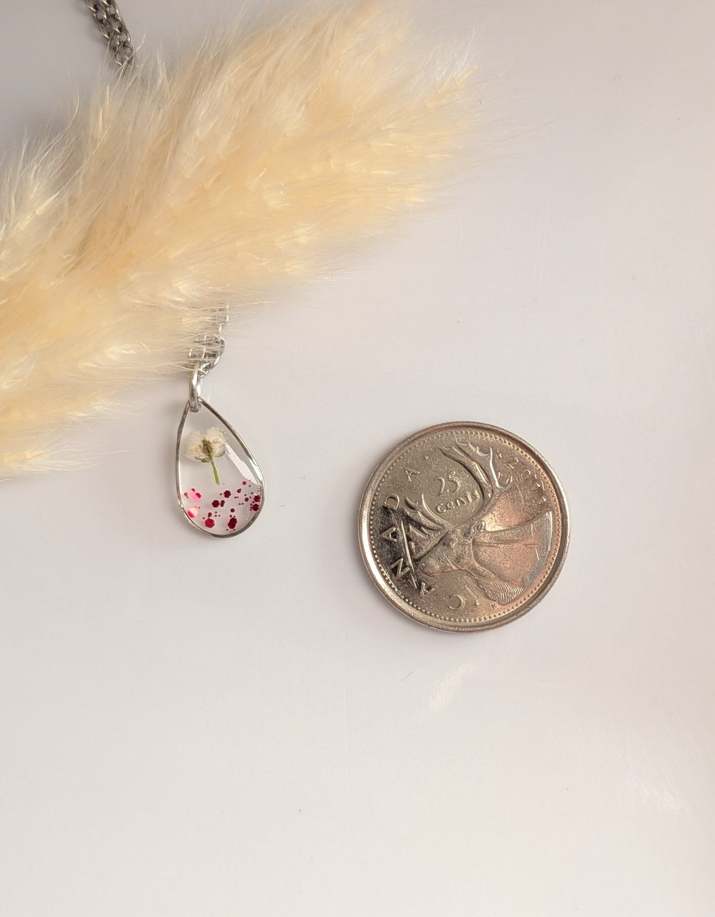 Red glitter, white floral teardrop